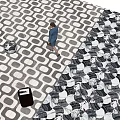Stylish Black And White Geometric Pattern Floor Tiles In Public Lobby With Pedestrian