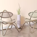 Two Transparent Leisure Chairs With Metal Frame White Layered Vase And Green Plant