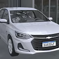 White Chevrolet Compact Car With Modern Exterior Design And Sleek Body Lines