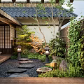 Traditional Japanese Courtyard Garden With Stone Stepping Path Lanterns Wooden Deck And Lush Greenery