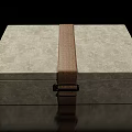 Decorative Ornament Set With Gray Textured Box Brown Strap And Metal Clasp