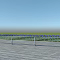 Metal Fence on Wooden Platform with Blue Flower Field and Clear Blue Sky