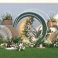 Outdoor Photo Check In Spot With Green Grass And Circular Ring Flower Decorations