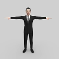 Man In Black Suit With Tie Standing With Arms Outstretched On Gray Background