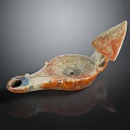 Ancient Carved Oil Lamp In Red Brown With Blue Accents And Decorative Handle