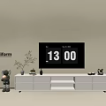Modern White TV Stand With TV Decorations Plant And Stuffed Bear On Beige Wall