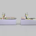 White Display Tables With Assorted Food Items And Fresh Floral Decorations