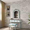Light Blue Dressing Table With Mirror Floral Stool And Decorative Paintings Against Brick Wall