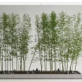 Tall Bamboo in Rectangular Stone Planter with Lush Green Leaves and Small Stones at Base