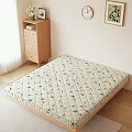 Comfortable Mattress With Diamond Quilted Leaf Print On Wooden Floor And Cabinet