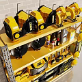 Workshop Display Shelf With Yellow And Black Tools Tool Rolls And Bottles