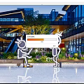 Ideal Photo Check in Spot At Modern Urban Plaza With Architectural Buildings And Green Plants