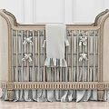 Classic Beige Upholstered Baby Crib With Bow Ties Soft Blanket And Ruffled Skirt