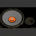 Black Audio Speaker With Orange JBL Logo And Worn Exterior Design