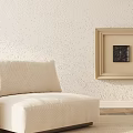 Beige Single Sofa With Cushion Against Textured Wall And Beige Framed Painting
