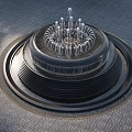 Circular Multi Tiered Water Fountain With Top Water Jets On Gray Paved Ground