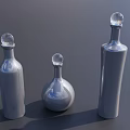 Silver Wine Bottles With Transparent Spherical Caps Arranged On Dark Background In Different Shapes