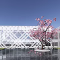Modern White Sales Office Building With Geometric Facade Pink Flowering Tree And Water Pool