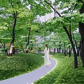 Modern Garden Landscape Design With Green Lawn Trees Stones And Sofa Coffee Table
