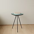 Stylish Green Hexagonal Side Table With Black Tripod Legs And Book On Top 3d model