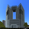 Modern High Rise Office Building With Glass Curtain Wall And Green Trees Under Blue Sky