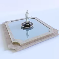 Elegant Water Fountain With Central Statue Square Stone Base Clear Water Reflection And Decorative Frame