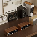 Various Audio Speakers Including Wooden And Modern Designs On Table Top