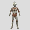Silver and Red Ultraman Game and Movie Character With Glowing Eyes and Blue Chest Gem