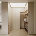 Modern Minimalist Walk in Closet Interior With Beige Cabinets Drawers Hanging Rods And Soft Lighting