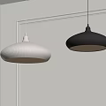 Two Modern Black and White Pendant Lights in Interior Room