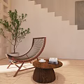 Stylish Woven Leisure Chairs In Sunlit Interior With Potted Olive Tree And Wooden Table