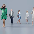 Group of People in Various Fashionable Outfits Standing Against Gray Background
