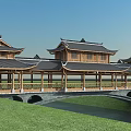 Traditional Chinese Wooden Bridge with Curved Roof Over River in Grassland Under Blue Sky