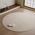 Beige Woven Round Area Rug on Wooden Floor with Open Book and Window