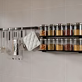 Spice Jars Organized On Black Wall Rack With Kitchen Utensils And Grey Tiled Background