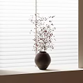 Dark Ceramic Vase with Small Flowers on Bright Windowsill Lit by Light Through White Blinds
