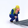 Man in Yellow Hard Hat and Safety Vest Crouching to Measure Metal Frame with Tools