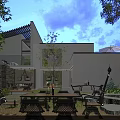 Modern Detached Villa Exterior With Outdoor Courtyard Landscaping Trees And Evening Lighting