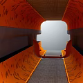 Elevator Hallway With Modern Design Orange Textured Walls Gray Tiled Floor And Natural Light