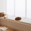 Stylish Window Seat Area With Decorative Pillows White Blinds Curtain And Open Magazine