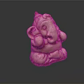 Light Brown Ganesha Sculpture With Detailed Trunk Ears Seated Posture On Dark Background With Reflection