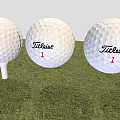 Three Titleist 1 Golf Balls As Sports Equipment Placed On Grass With Tee