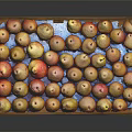 Fresh Yellow and Red Pears Filled in Wooden Tray on Black Background