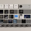 Various Colored Switch Panels With Outlets And Digital Displays Showing Time Temperature