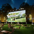 Outdoor Night Stage With Starry Sky Trees Grass Large Screen Camping Games And Tables