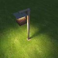 Modern Outdoor Light with Square Shade and Metal Pole on Green Grass Lawn Illuminating Ground