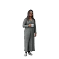 Woman Wearing Grey Patterned Long Dress Holding White Cup Standing Casually