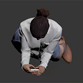 A Woman Wearing White Shirt And Blue Denim Skirt Using Smartphone Against Gray Reflective Floor
