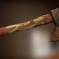 Old Rusted Axe With Worn Wooden Handle And Red Grip As Historical Weapon