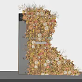 Artistic Floral Installation Featuring Warm Tones Flowers And Natural Foliage